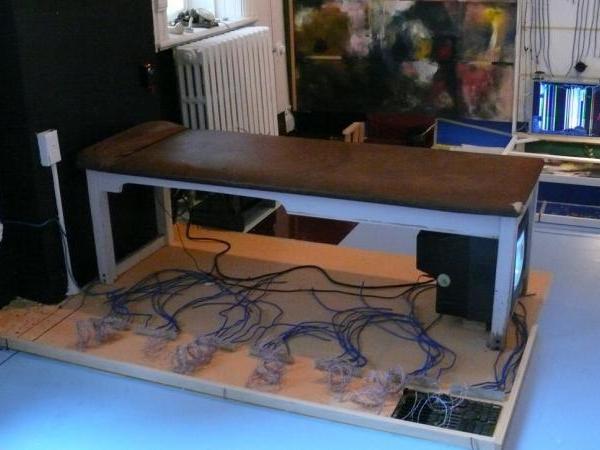 Image 15: VP2, Naccarato - Right Top Detail - TV Set, massage table, painted floor, coaxial cables