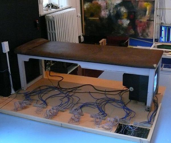 Image 15: VP2 partial overview, Naccarato - Right Top Detail - TV Set, massage table, painted floor, coaxial cables